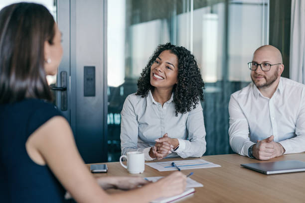 istock Confident smiling businesswoman talking on a meeting 2201547090