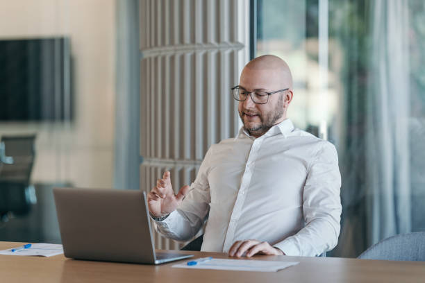 istock Confident businessman during a video conference in the office 2201547104