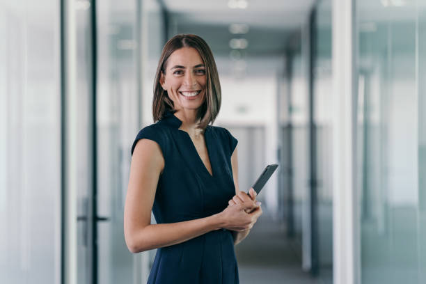 istock Successful businesswoman with digital tablet 2201547113