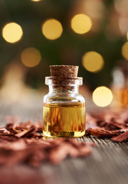 istock A bottle of aromatherapy essential oil with red sandalwood chips 2201548936