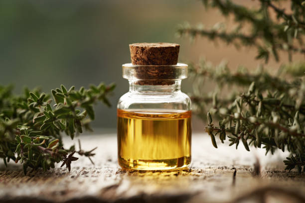 istock A transparent bottle of thyme essential oil with fresh thyme 2201548946