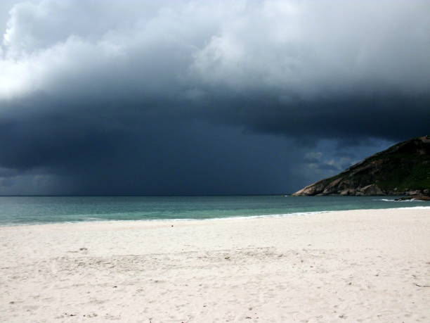 istock A heavy rainstorm coming on a desert beach with white sand 2201552668