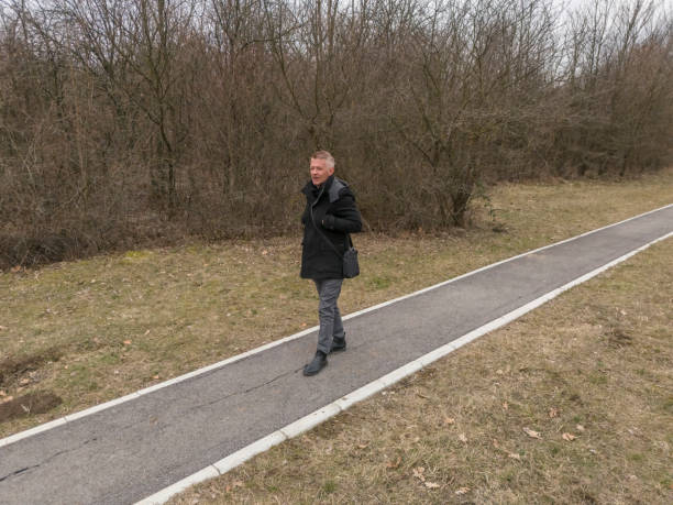 Adult man enjoy walking in public park