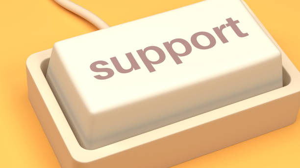 The button represents customer service, technical assistance, online help, troubleshooting, and user support in digital spaces. A close-up of a computer keyboard with the word Support displayed on the key.