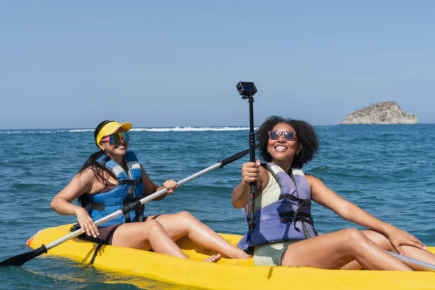 istock Two happy women taking a selfie while kayaking on a sunny day 2201572131