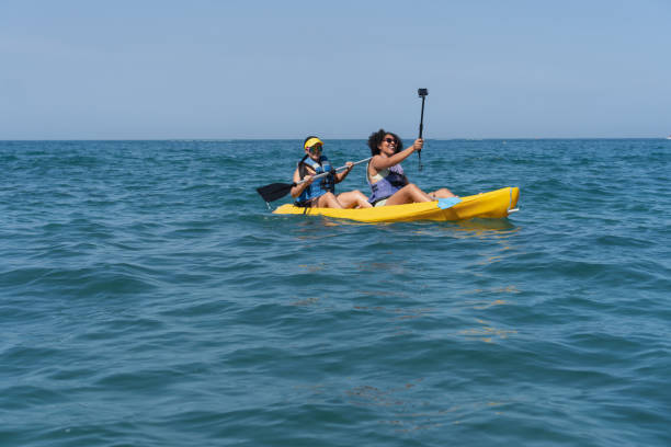 istock Two women kayaking at sea and taking a selfie 2201572177