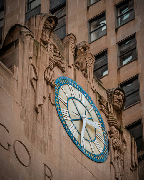 Figures representing a Babylonian holding grain and a Native American holding corn with an eagle over a large clock at the Chicago Board of Trade in downtown Chicago, Illinois.