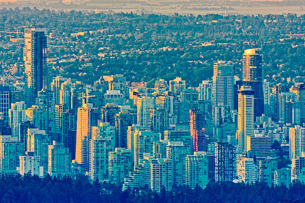 Downtown view of Vancouver and Stanley Park from North Vancouver at sunrise, British Columbia