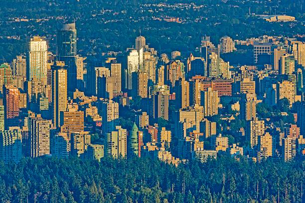 Downtown view of Vancouver and Stanley Park from North Vancouver at sunrise, British Columbia