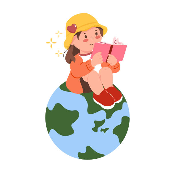 istock A young girl wearing a yellow hat is reading a book on a globe. 2201588604