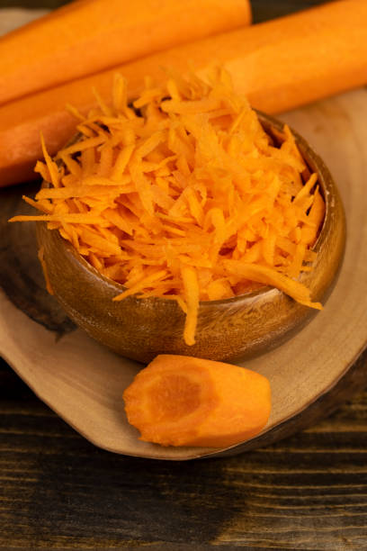 istock grated orange carrots on the table during cooking 2201593212