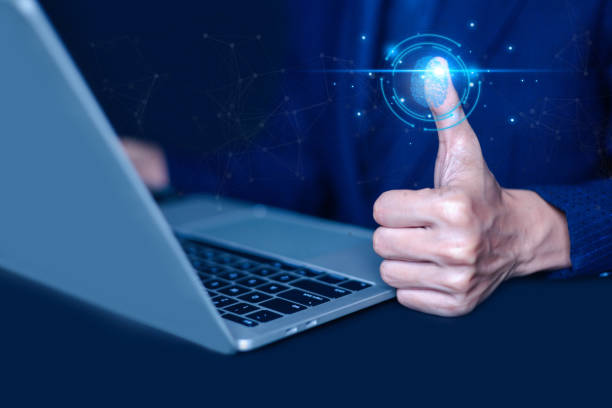 istock Biometric fingerprint scanning is an identification technology that can be used to protect the security of networks as a unique identity of the person. Authentication is done using the thumb. 2201594282