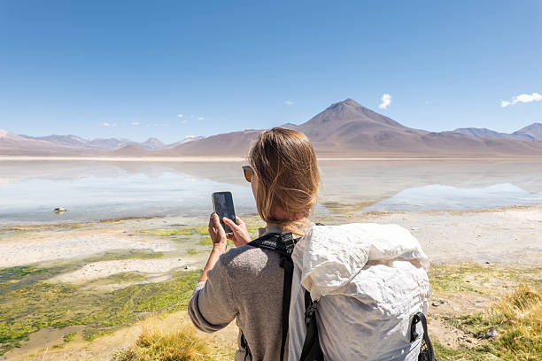 istock Traveler with Backpack Captures Scenic Mountain Lake View 2201594682