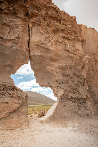 istock Eroded Rock Arch in a Remote Desert Landscape 2201595371