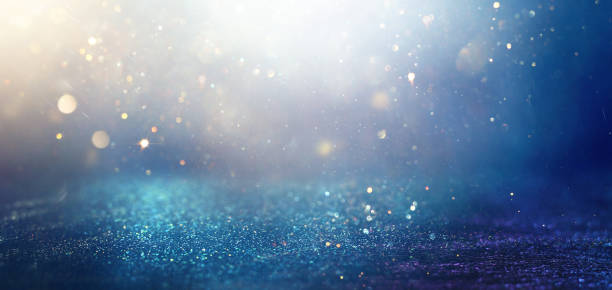 istock background of abstract glitter lights. gold and blue. de focused 2201595855