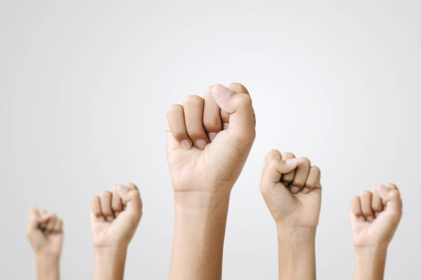 istock A group of people are holding up their hands 2201599438