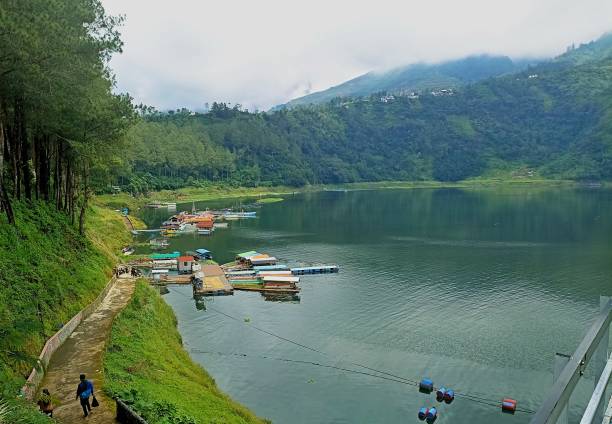 istock a cloudy atmosphere in the lake with several ships bowed. The location at Telaga Menjer Wonosobo, Indonesia 2201601258
