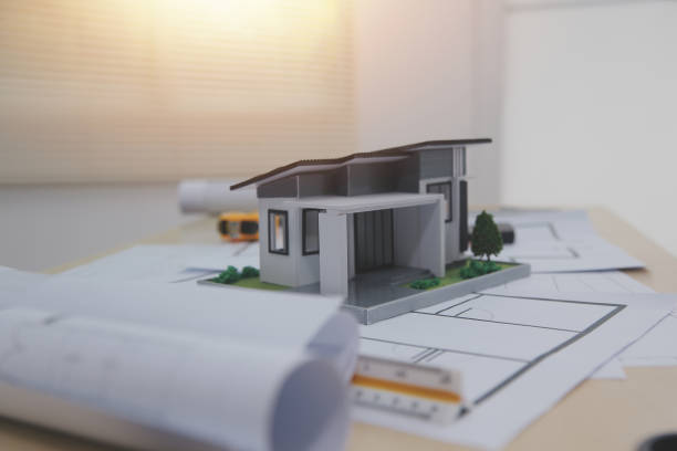 istock Architects, engineers, contractors working in the office with blueprints, inspection engineers Work analysis for architectural plan, construction project sketch, focus, business construction concept. 2201608087