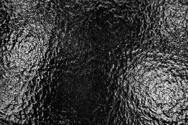 istock Textured glossy black hammertone embossed powder coating aluminum stucco surface abstract gradient dark wall background 2201610153