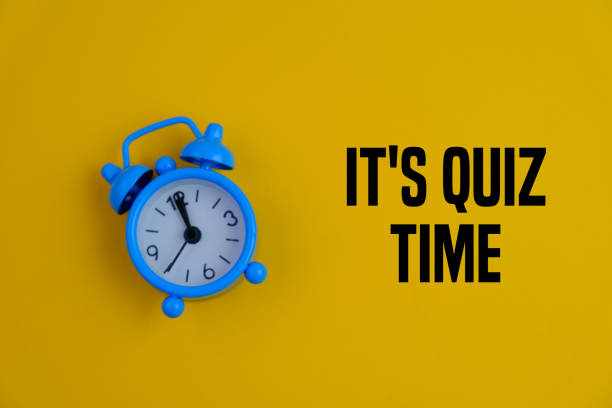 istock the words Quiz Time beside mini alarm clock on a plain background. the concept of answering quizzes or quiz games. text space 2201615577