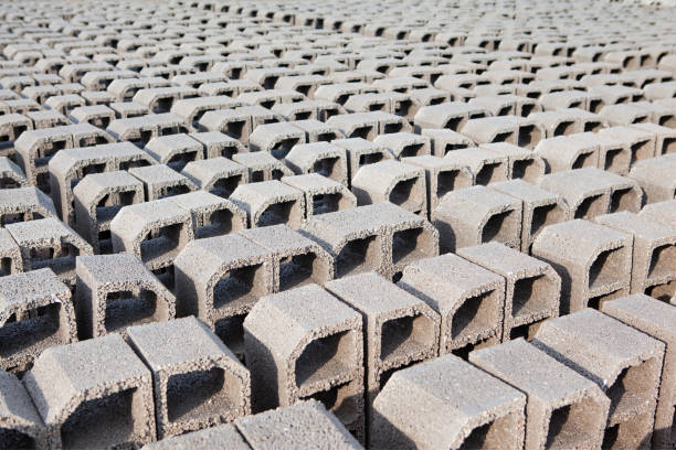 Red brick pallets are stored in an open area.