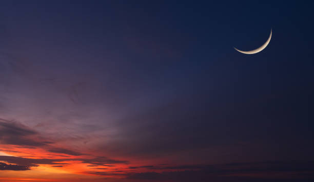 istock Crescent moon on dusk sky twilight after sundown, well free space for text Arabic religious of Islamic Ramadan Kareem, Eid al Fitr, Eid al Adha, Eid Mubarak 2201625019