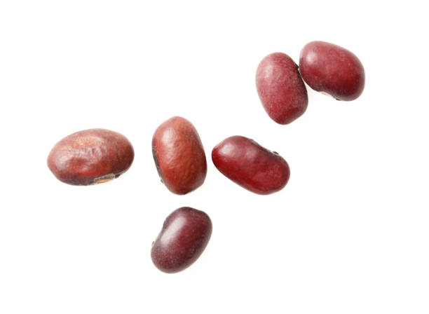 istock A bunch of red beans are spread out on a white background 2201627699