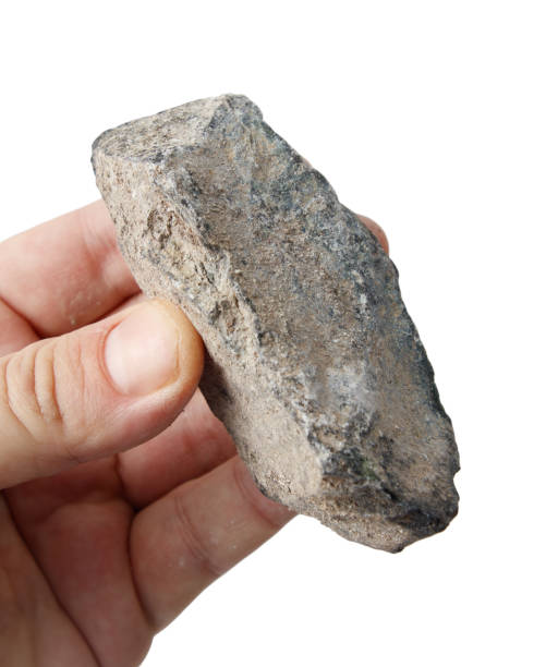 istock Jadeite stone in hand isolated on white background 2201627985