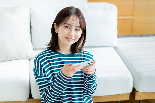 istock young woman calling on smartphone 2201632386
