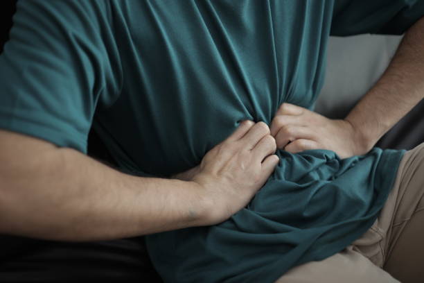 istock Abdominal massage relieves stomach pain and constipation. 2201632843
