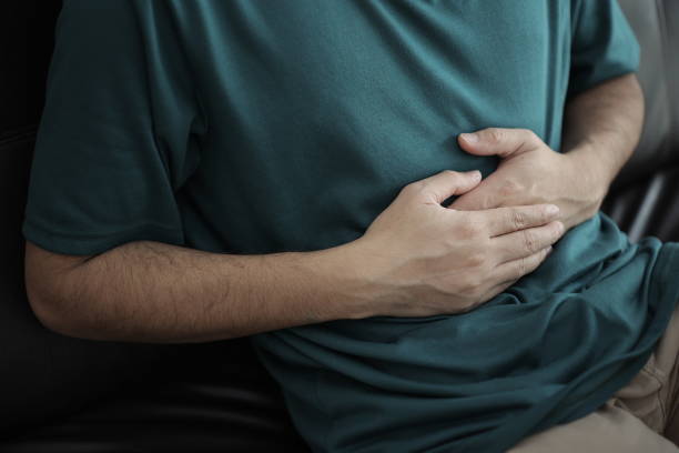 istock Abdominal massage relieves stomach pain and constipation. 2201632849