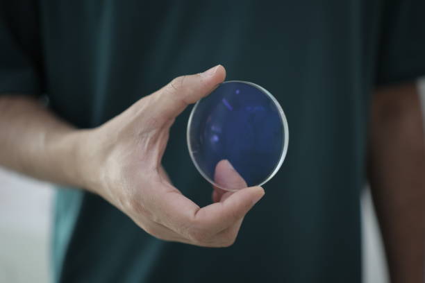 Hand a doctor holding glasses lenses, eyeglasses lens