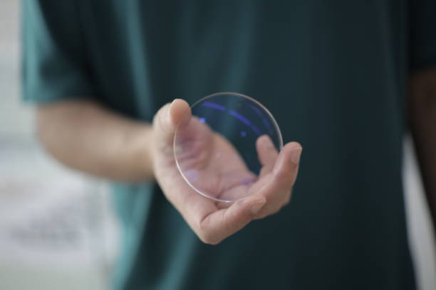 istock Hand a doctor holding glasses lenses 2201632959