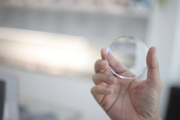 istock Hand a doctor holding glasses lenses 2201632970