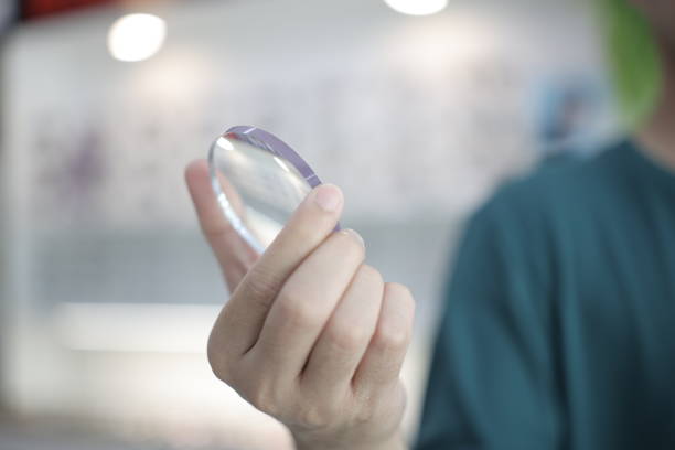 istock Hand a doctor holding glasses lenses 2201632983