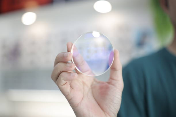 istock Hand a doctor holding glasses lenses 2201632986