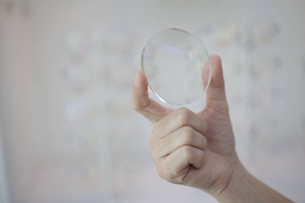 Hand a doctor holding glasses lenses, eyeglasses lens