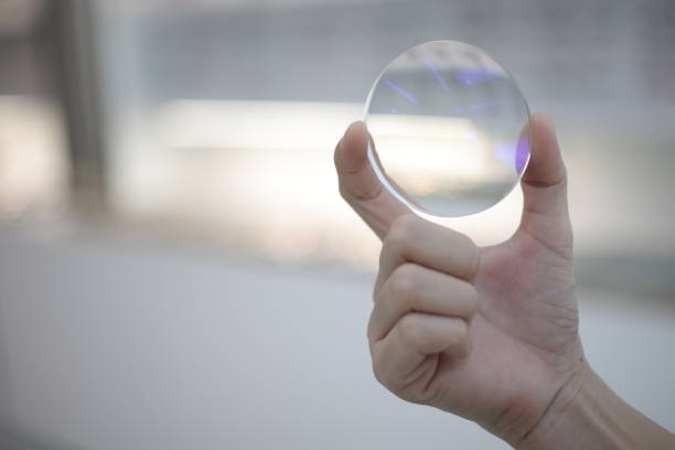 istock Hand a doctor holding glasses lenses 2201633016