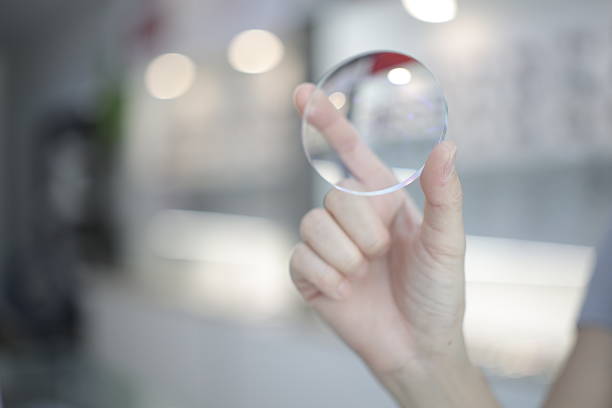 istock Hand a doctor holding glasses lenses 2201633084
