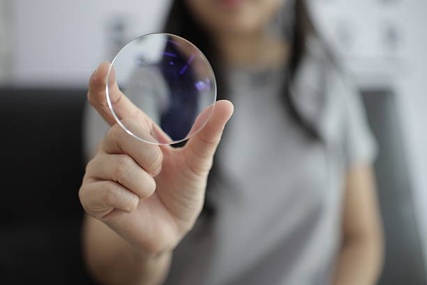 istock Hand a doctor holding glasses lenses 2201633106