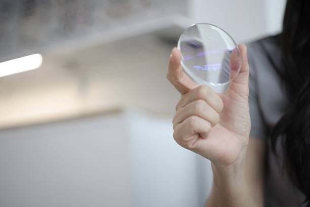 istock Hand a doctor holding glasses lenses 2201633136