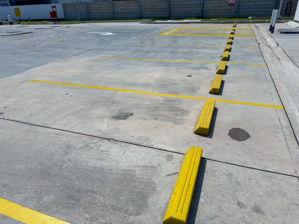 istock Empty parking lot with yellow and orange marking on the ground, outdoor 2201635542