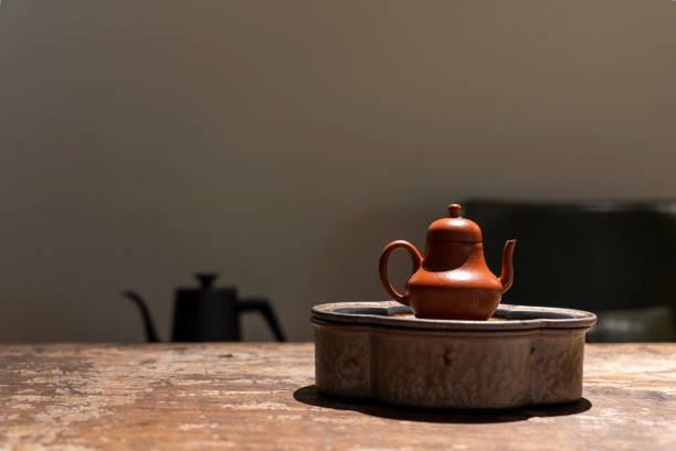 istock Purple clay teapot on the tea table 2201636406