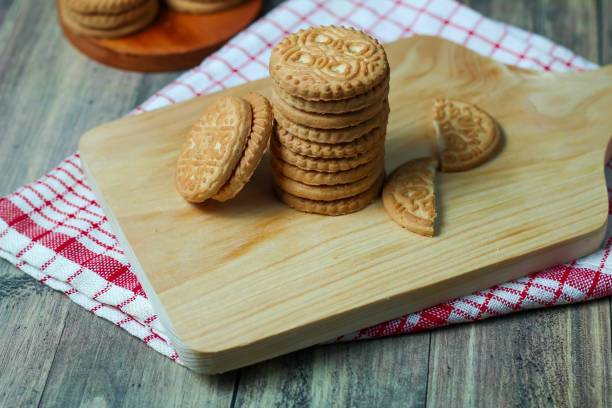 istock stack of delicious almond biscuits on a wooden board 2201640841