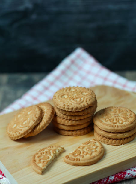 istock stack of delicious almond biscuits on a wooden board 2201640858