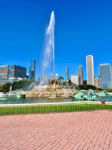 Sunny early Summer landscape of the Clarence F. Buckingham Memorial Fountain in Grant Park, with the City skyline in the distance.