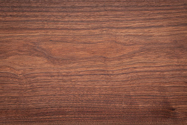 istock Walnut wood planks texture background. Walnut wood planks panning video texture background. Empty wood planks desktop panning background. Empty desktop. 2201647140