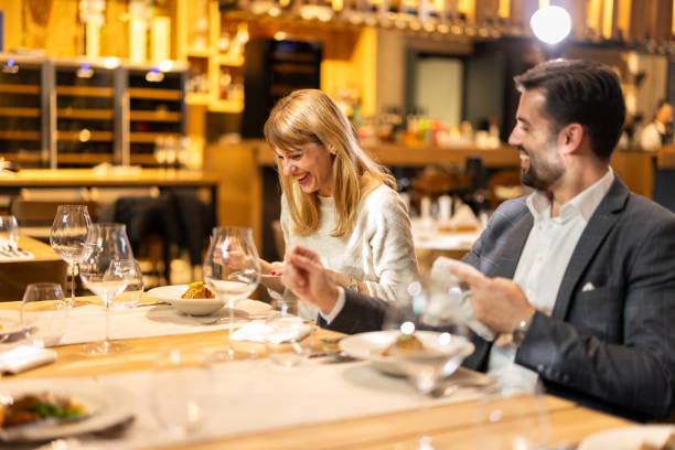 istock Happy couple dinning in luxury restaurant 2201652454