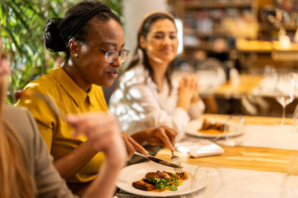istock Multiracial female friends dinning in luxury restaurant 2201652717