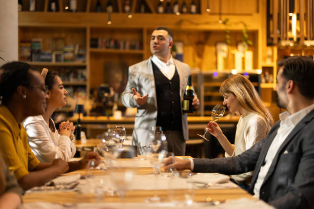 istock Multiracial group of people sitting in luxury restaurant 2201654265